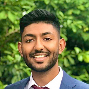 Head shot of male dental professional in suit jacket and tie
