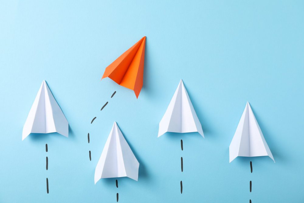 paper-airplanes-on-blue-background-space-for-text-2022-02-03-03-56-11-utc-min